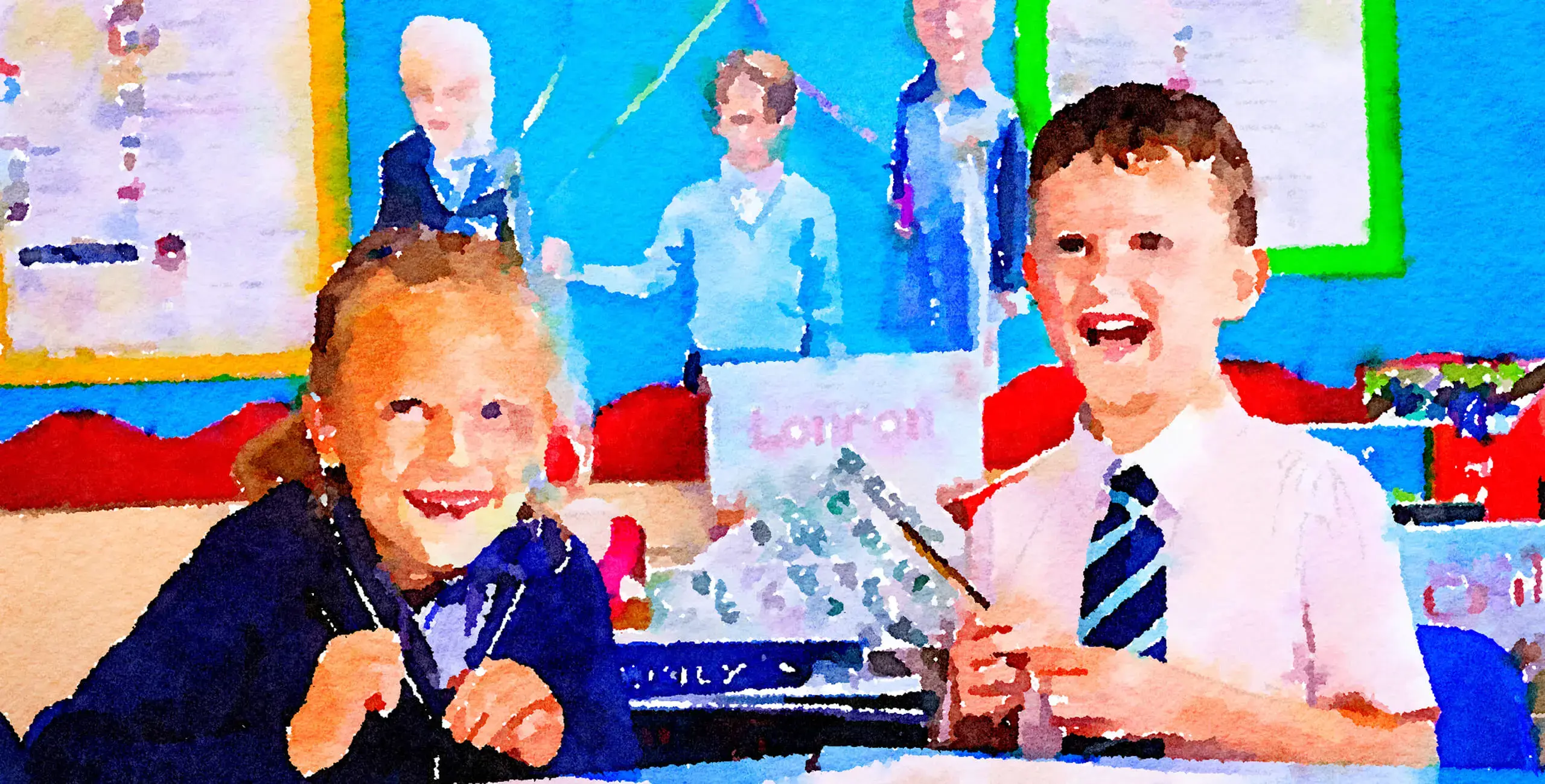 Two King’s Ely Pre-Prep students sitting at a desk, smiling and looking to camera.