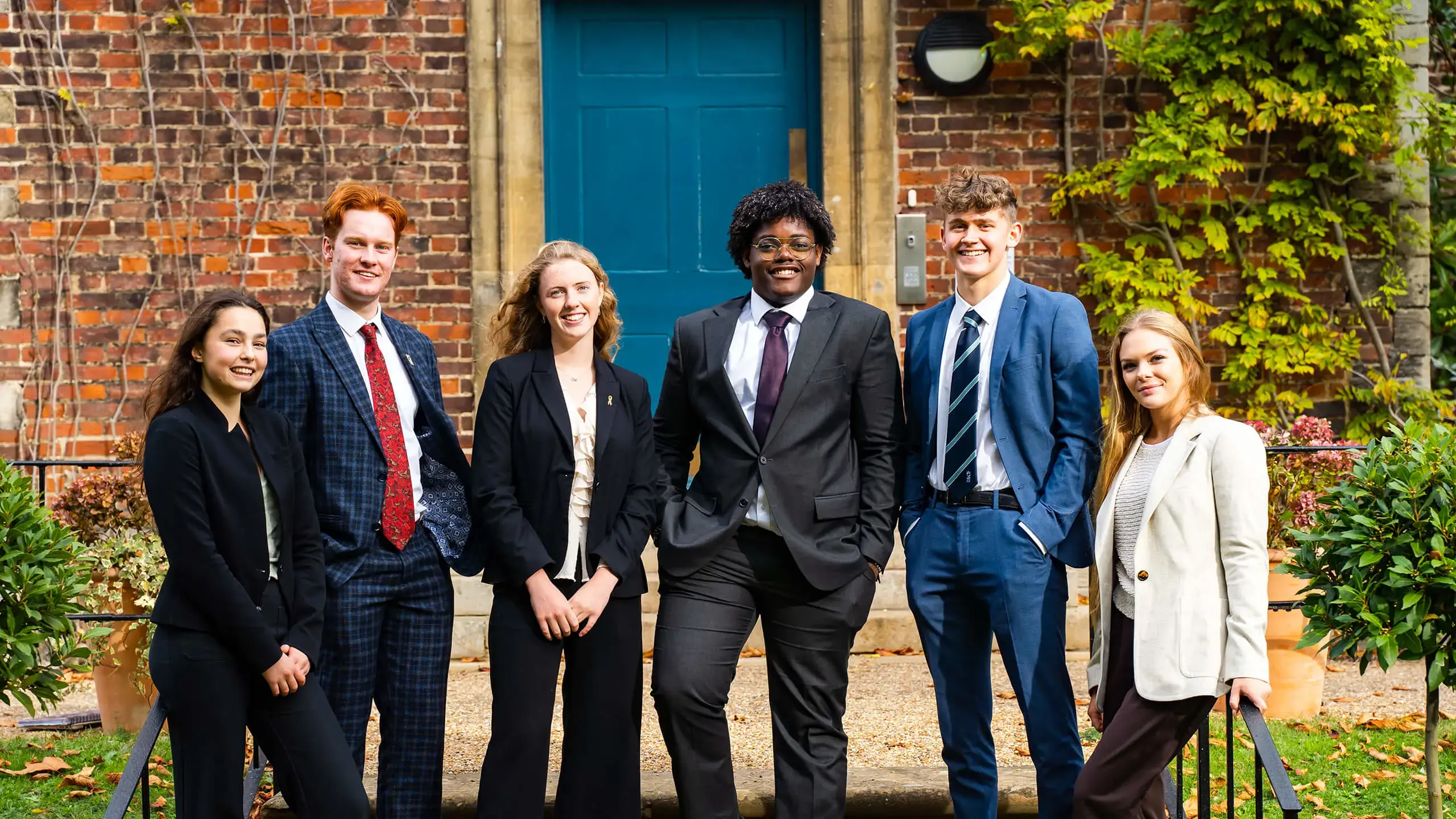 King's Ely Sixth Form students outside the Old Palace in Ely 